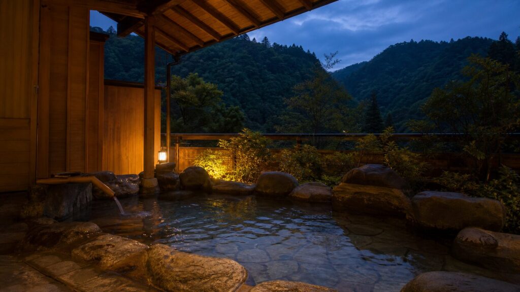 山あいの温泉宿にある露天風呂の生成イメージ